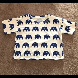 White top with blue elephants on it